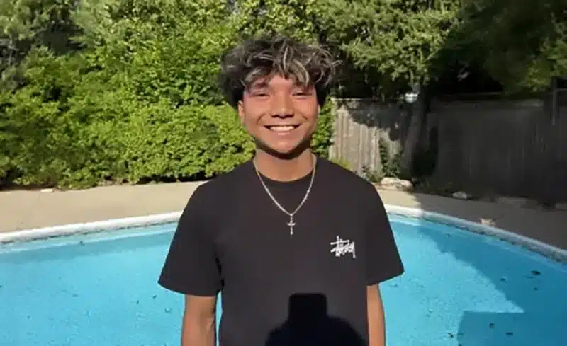 A teen smiling confidently